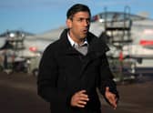 Prime Minister Rishi Sunak stands in front of Typhoon fighter jets as he speaks during a television interview during his visit to Royal Air Force RAF Coningsby, near Lincoln. Picture: Joe Giddens/POOL/AFP via Getty Images
