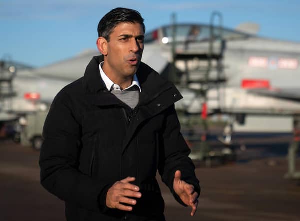 Prime Minister Rishi Sunak stands in front of Typhoon fighter jets as he speaks during a television interview during his visit to Royal Air Force RAF Coningsby, near Lincoln. Picture: Joe Giddens/POOL/AFP via Getty Images