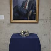 The Advent wreath on display beneath a portrait of devolved Scotland's founding First Minister Donald Dewar MSP.
