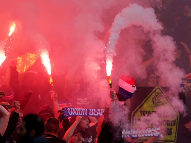 Rangers fans celebrate at full time after