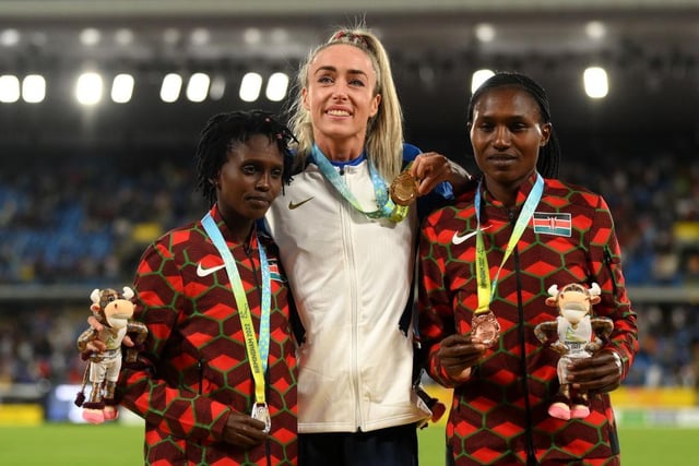 Eilish McColgan on the podium after her 10,000m triumph, flanked by silver medalist Irine Chepet Cheptai and bronze medalist Sheila Chepkirui Kiprotich, both of Team Kenya.