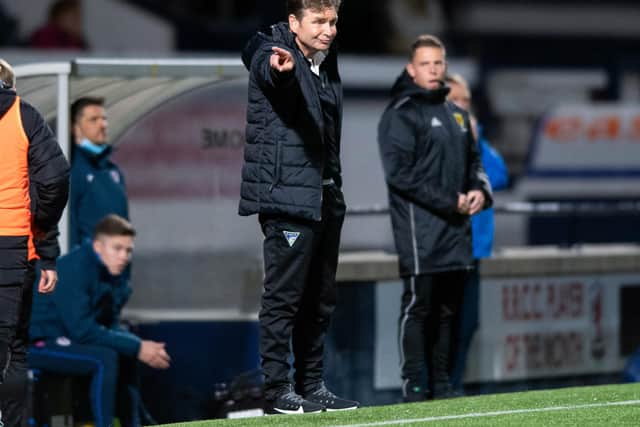 Dunfermline manager Peter Grant gives instructions from the sidelines.