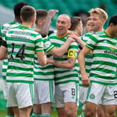 Scott Brown, centre, played his last match at Celtic Park as a Hoops player and set up Odsonne Edouard for their second goal against St Johnstone.