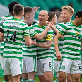 Scott Brown, centre, played his last match at Celtic Park as a Hoops player and set up Odsonne Edouard for their second goal against St Johnstone.