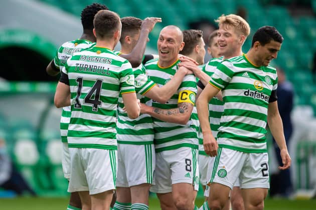 Scott Brown, centre, played his last match at Celtic Park as a Hoops player and set up Odsonne Edouard for their second goal against St Johnstone.