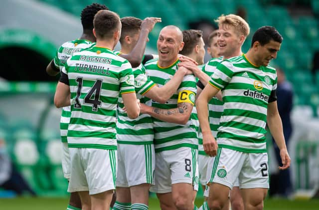 Scott Brown, centre, played his last match at Celtic Park as a Hoops player and set up Odsonne Edouard for their second goal against St Johnstone.