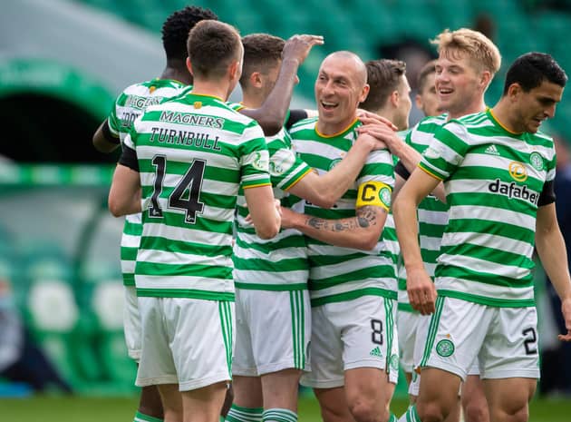 Scott Brown, centre, played his last match at Celtic Park as a Hoops player and set up Odsonne Edouard for their second goal against St Johnstone.