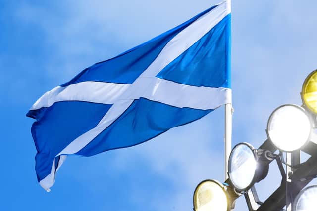 The Scottish flag above Hampden Park, where the SPFL may soon usher in change.