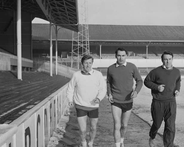 (Left to right) Cliff Jones, Alan Gilzean and Jimmy Greaves doing laps of White Hart Lane in January 1965. (Photo by J. R. Watkins/Daily Express/Hulton Archive/Getty Images)