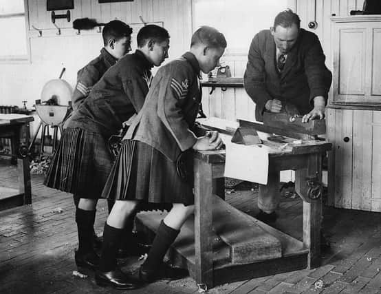 Three schoolboys at Queen Victoria School, Dunblane, in 1935 - education has changed beyond recognition (Picture: Getty)