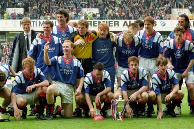 Rangers players celebrate with the Premier Division trophy at Ibrox in May 1993 after a campaign which included the 29-game unbeaten league run which Steven Gerrard's team are close to matching. (Photo by SNS Group).