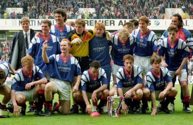 Rangers players celebrate with the Premier Division trophy at Ibrox in May 1993 after a campaign which included the 29-game unbeaten league run which Steven Gerrard's team are close to matching. (Photo by SNS Group).