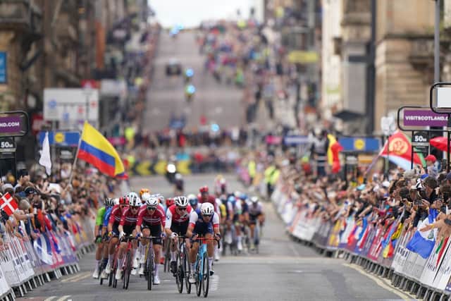 France's Benoit Cosnefroy leads a group of riders along George Square in Glasgow during day four of the 2023 UCI Cycling World Championships. Picture: Tim Goode/PA Wire.