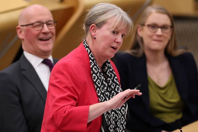 Finance Secretary Shona Robison delivers the Scottish Budget on Wednesday, watched by a beaming John Swinney (Picture: Jeff J Mitchell/Getty Images)