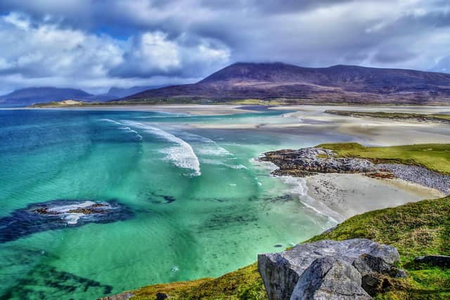 Images of bright skies, turquoise seas and sandy beaches are part of the draw for international holidays, but academics argue that staycationers could get all that in Scotland - this picture was taken at the spectacular Luskentyre bay on the Isle of Harris. Picture: Getty Images