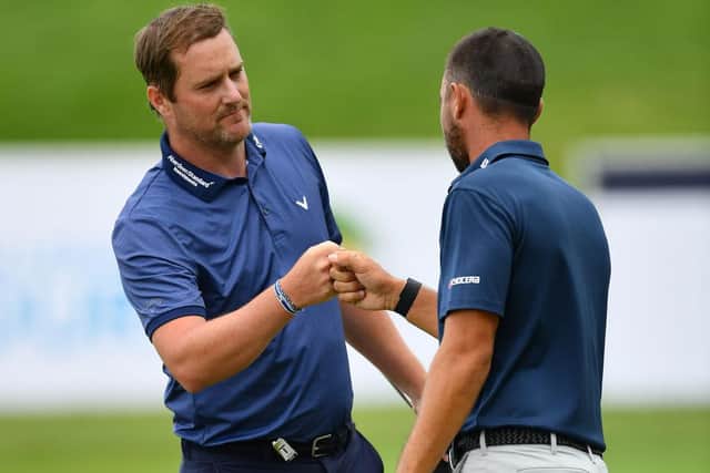 Marc Warren is congratulated by Spaniard Sebastian Garcia Rodriguez after winning the Austrian Open at Diamond Country Club last July. Picture: Stuart Franklin/Getty Images.