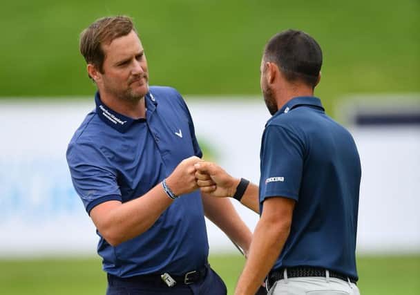 Marc Warren is congratulated by Spaniard Sebastian Garcia Rodriguez after winning the Austrian Open at Diamond Country Club last July. Picture: Stuart Franklin/Getty Images.