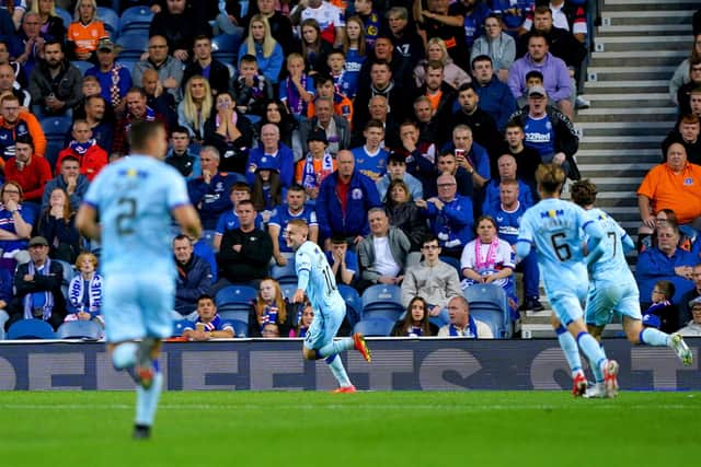 Queen of the South's Lee Connelly celebrates scoring against Rangers.