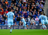 Queen of the South's Lee Connelly celebrates scoring against Rangers.