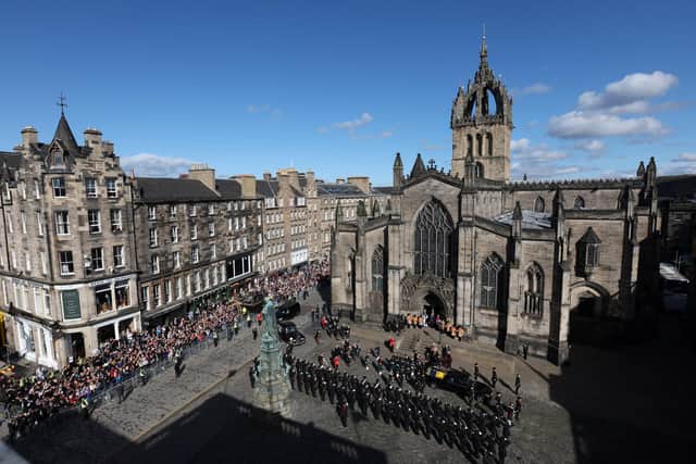 Vast crowds gathered outside St Giles' as Elizabeth II's coffin was taken up the Royal Mile for the service of thanksgiving. Picture: Russell Cheyne/WPA Pool/Getty