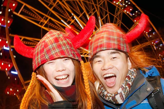 If Edinburgh is supposed to put on an authentic Scottish Hogmanay, why are the revellers served gluhwein? (Picture: Danny Lawson/PA)