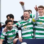 Callum McGregor (second left) leads the Celtic celebrations at Tannadice after another Premiership title triumph  (Photo by Craig Foy / SNS Group)