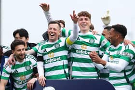 Callum McGregor (second left) leads the Celtic celebrations at Tannadice after another Premiership title triumph  (Photo by Craig Foy / SNS Group)