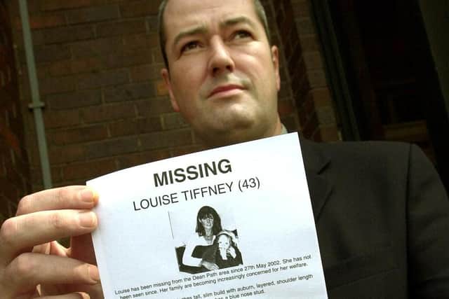 Det Sgt Robert Millar with a missing person poster during the 2002 investigation.