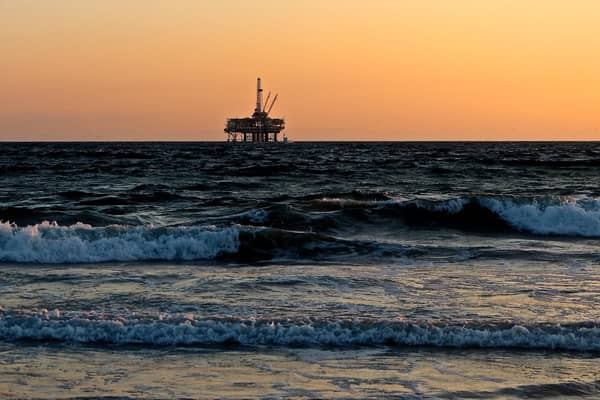 Deputy First Minister John Swinney has cited the North Sea windfall tax amid arguments over deficits outlined in the latest GERS figures