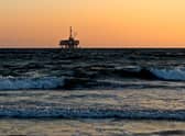 Deputy First Minister John Swinney has cited the North Sea windfall tax amid arguments over deficits outlined in the latest GERS figures