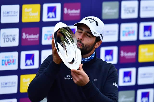 Adrian Otaegui of Spain kisses the trophy following his victory in the Scottish Championship presented by AXA at Fairmont St Andrews. Picture: Mark Runnacles/Getty Images