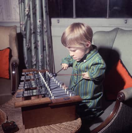 A seven-year-old child affected by the drug thalidomide plays the xylophone in 1968 (Picture: Paul Fievez/BIPs/Getty Images)