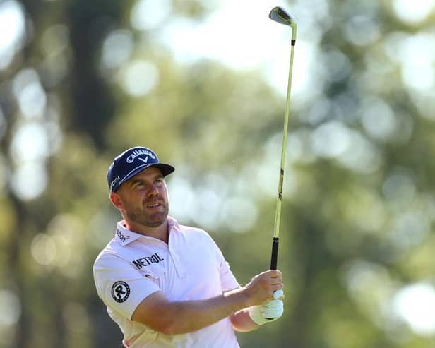 Richie Ramsay plays his second shot on the ninth hole during day one of the BMW PGA Championship at Wentworth Club. Picture: Andrew Redington/Getty Images.