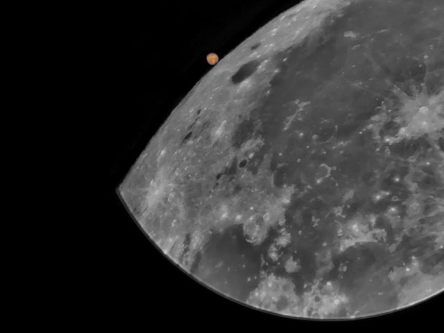 Highly Commended
Lunar Occultation of Mars © Joshua Harwood-White
The lunar occultation of Mars was one of the most interesting celestial events of 2022. Here, an iPhone was used with a Celestron Astromaster 102az Refractor Telescope to capture the moment just before the Moon blocked our view of Mars.
‘This image showcases the capabilities of modern technology. Just a smartphone and modest telescope have been used to beautifully capture a fantastic celestial showcase from 2022. Often in astrophotography, the key to success is being able to react quickly to an event. With occultations this is even more important as they happen fast and require timing and preparation. In addition, the processing and presentation of the image is fantastic and it really feels like a moment snapped in time.’ - Steve Marsh
Taken with a Celestron Astromaster 102AZ Refractor telescope, 102 mm Achromatic lens, Manual Alt Azimuth mount, Apple iPhone SE