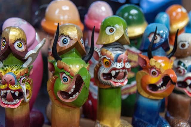 Phallus statues, a symbol for good luck and fertility, for sale at a souvenir shop in Bhutan. Pic: PA Photo/Sarah Marshall