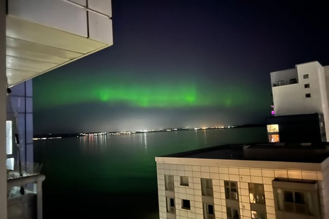 The mysterious green lights were reflected in the water of the Western Harbour in Newhaven, Edinburgh.