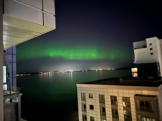 The mysterious green lights were reflected in the water of the Western Harbour in Newhaven, Edinburgh.