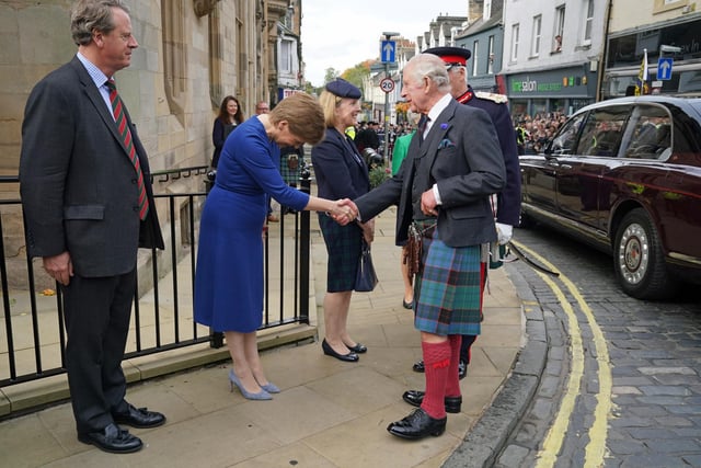 King Charles III shakes hands with First Minister Nicola Sturgeon as Scottish Secretary Alister Jack (left) looks on, as he arrives at the City Chambers in Dunfermline, Fife, to formally mark the conferral of city status on the former town.