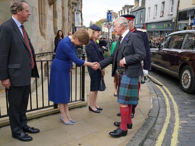 King Charles III shakes hands with First Minister Nicola Sturgeon as Scottish Secretary Alister Jack (left) looks on, as he arrives at the City Chambers in Dunfermline, Fife, to formally mark the conferral of city status on the former town.