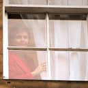 Nicola Sturgeon looks out of Bute House in Edinburgh after announcing she will stand down as First Minister (Picture: Andrew Milligan/PA)