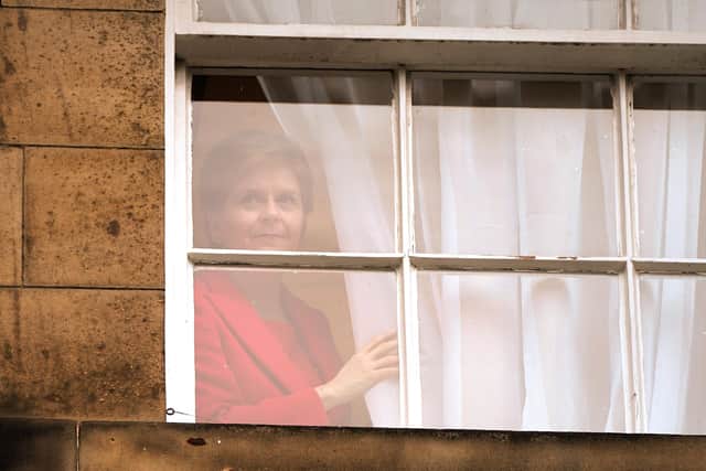Nicola Sturgeon looks out of Bute House in Edinburgh after announcing she will stand down as First Minister (Picture: Andrew Milligan/PA)