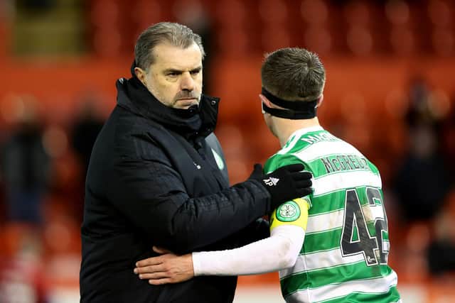 Celtic manager Ange Postecoglou (L) with Callum McGregor at full time during a cinch Premiership match between Aberdeen and Celtic.