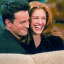 Actor Matthew Perry, best known for his role in the TV show 'Friends,' with actress Julia Roberts on the TV sitcom's set. Picture: Getty Images