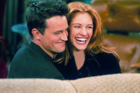 Actor Matthew Perry, best known for his role in the TV show 'Friends,' with actress Julia Roberts on the TV sitcom's set. Picture: Getty Images