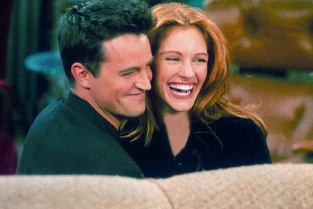 Actor Matthew Perry, best known for his role in the TV show 'Friends,' with actress Julia Roberts on the TV sitcom's set. Picture: Getty Images