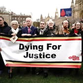 Infected blood victims and campaigners protest on College Green in Westminster.