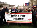 Infected blood victims and campaigners protest on College Green in Westminster.