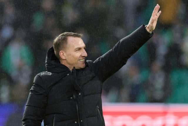 Celtic manager Brendan Rodgers celebrates with the fans after beating Rangers.