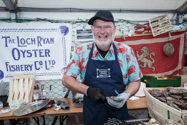 Shucking oysters at last year’s Stranraer Oyster Festival. PIC: Peter Robinson