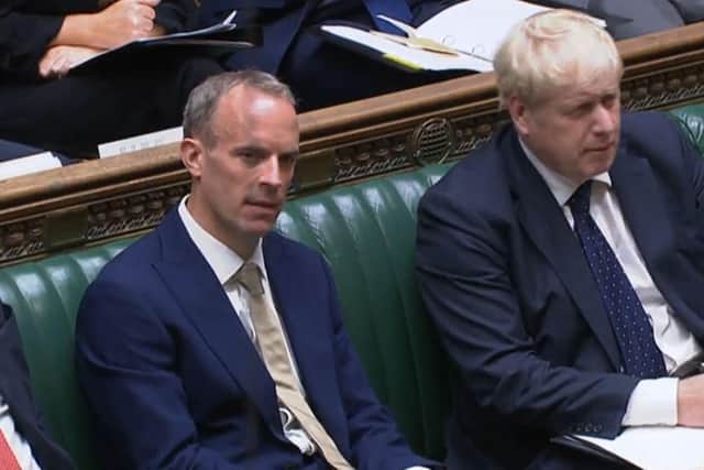 Foreign secretary Dominic Raab with Prime Minister Boris Johnson in the House of Commons. Picture: PA